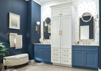 blue and white bathroom cabinets with storage tower