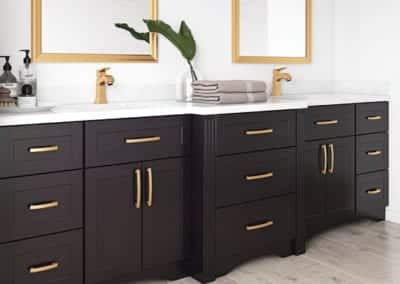 black bathroom vanity with gold hardware
