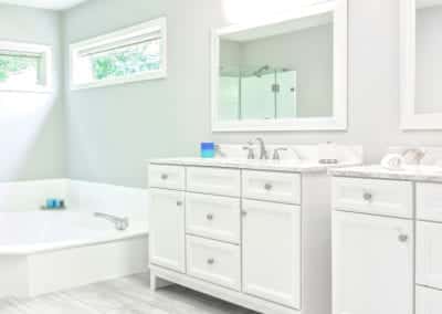 modern white bathroom with two separate vanities