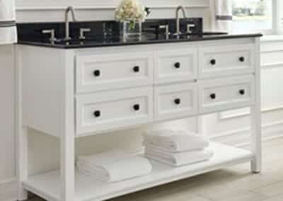 white custom bathroom vanity with black countertop