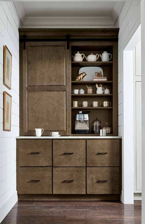 built-in coffee bar with storage cabinets