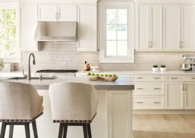 clean white kitchen with light hardwood floors