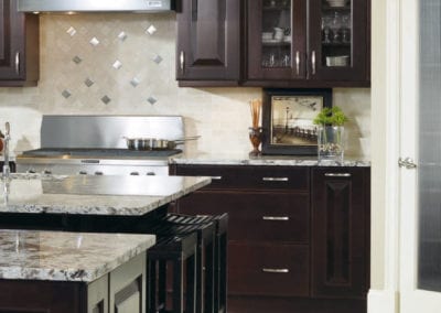 custom kitchen with dark brown wood cabinets