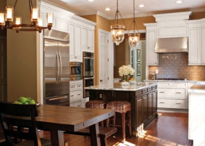 custom kitchen with white cabinets and wood island