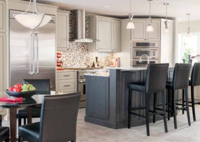 custom kitchen with white cabinets and dark grey island