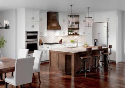custom kitchen with white cabinets and dark wood island