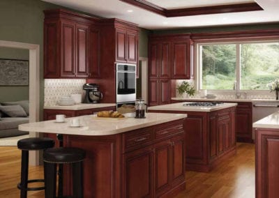 classic kitchen with dark wood cabinets and two islands