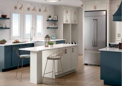 kitchen with blue cabinets and white island with bar seats