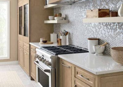 warm neutral kitchen with natural brown cabinets and mosaic backsplash