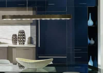 modern kitchen with navy glass cabinets