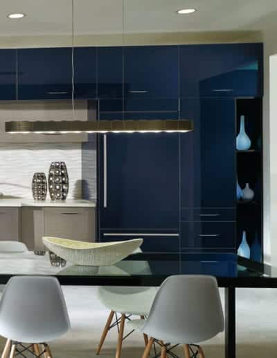 modern kitchen with navy glass cabinets