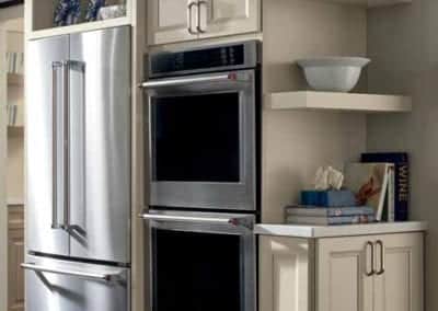 white kitchen cabinets with built-in appliances