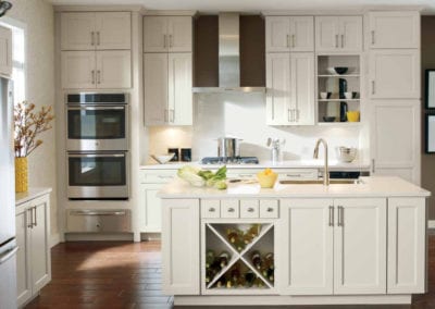 modern white kitchen cabinets and island with wine storage