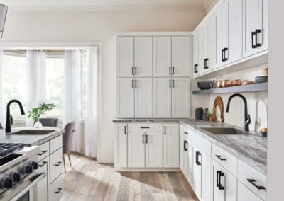 white kitchen cabinets with storage wall