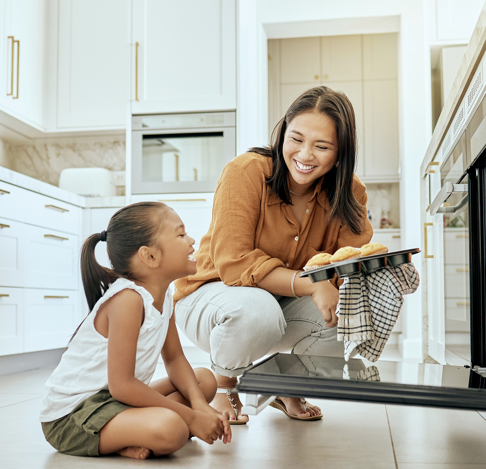 Mom and daughter with new kitchen and bathroom cabinetry